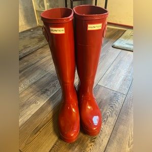 Tall HUNTER brand rain boots, glossy, red